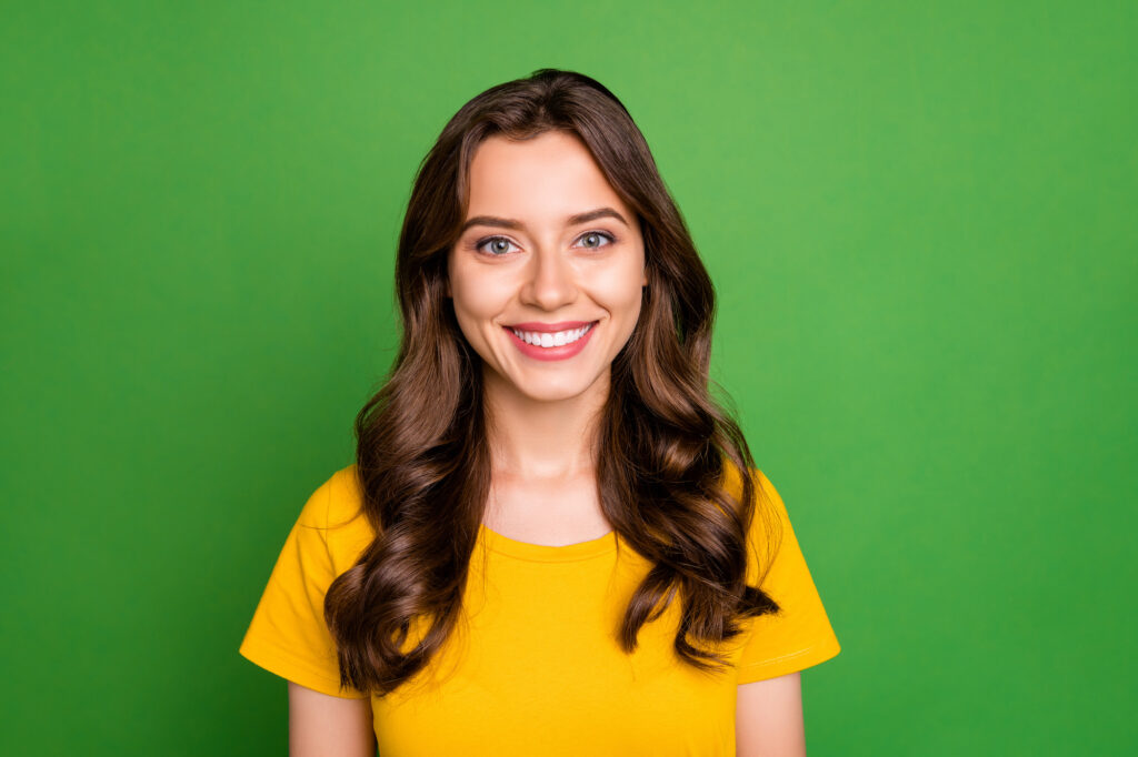Smiling woman with her beautiful corrected smile from Austin Orthodontic Services.